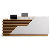 Wooden slatted reception desk with white front design.
