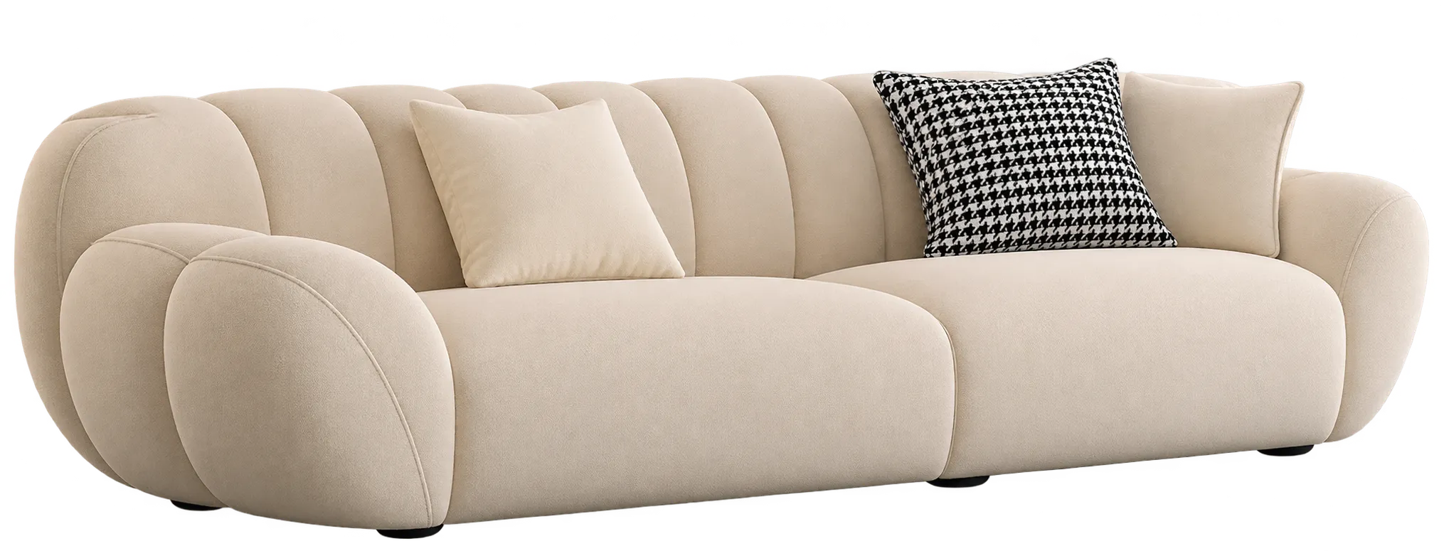 Beige lounge sofa with rounded back cushions and patterned accent pillow.