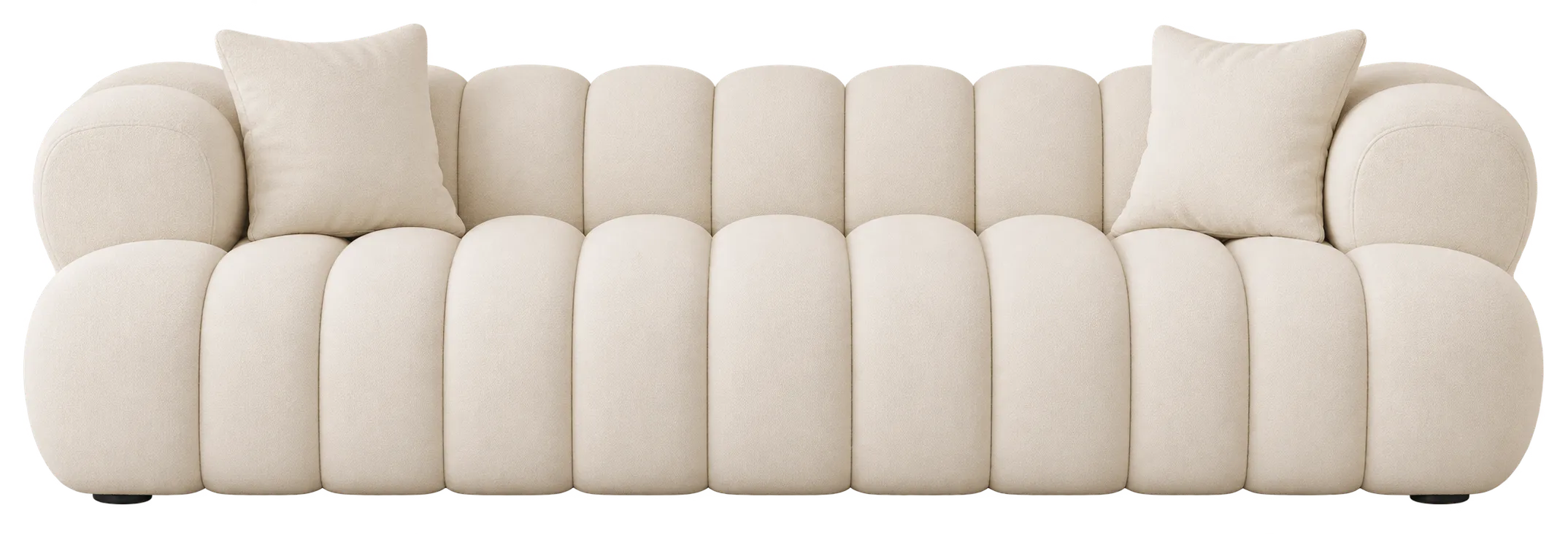 Cream sofa with vertical channel detailing across the backrest and arms.